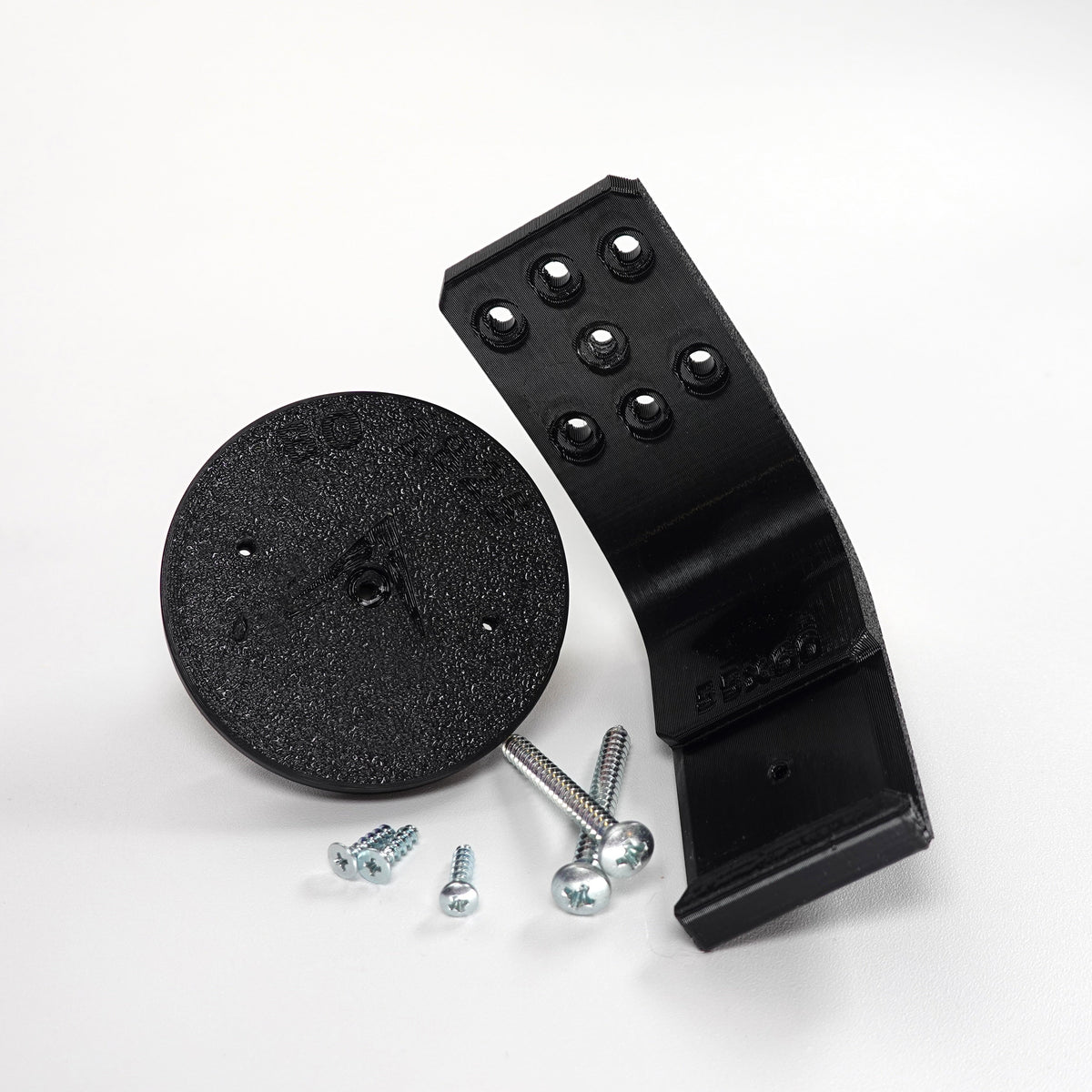 3D-printed black plastic soffit and ceiling mount for a Blink security camera.