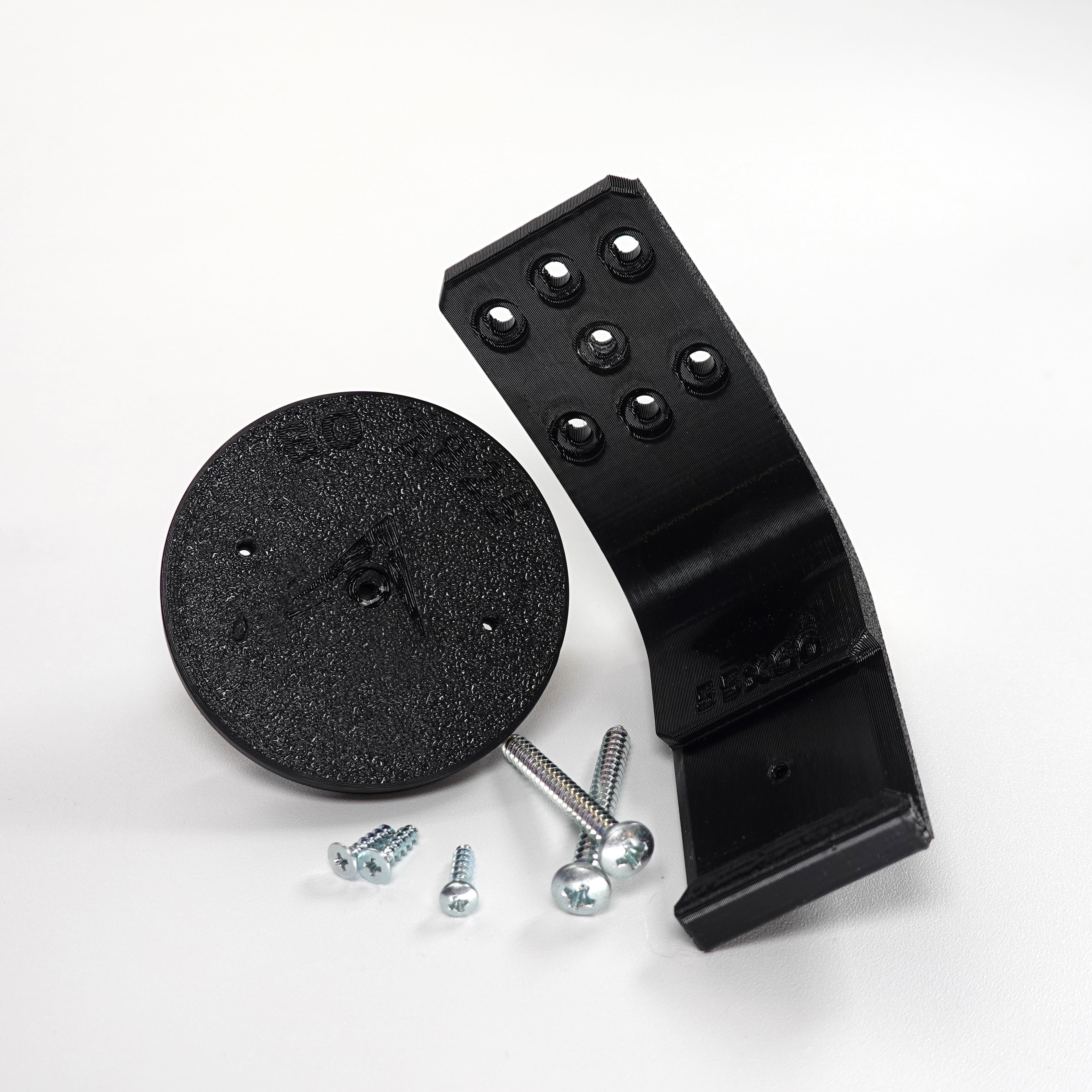 3D-printed black plastic soffit and ceiling mount for a Blink security camera.