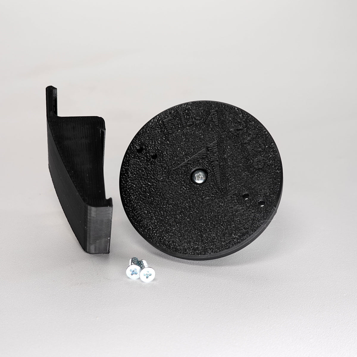 3D-printed Dutch lap siding clip and circular mounting base for a Blink camera, include screws.