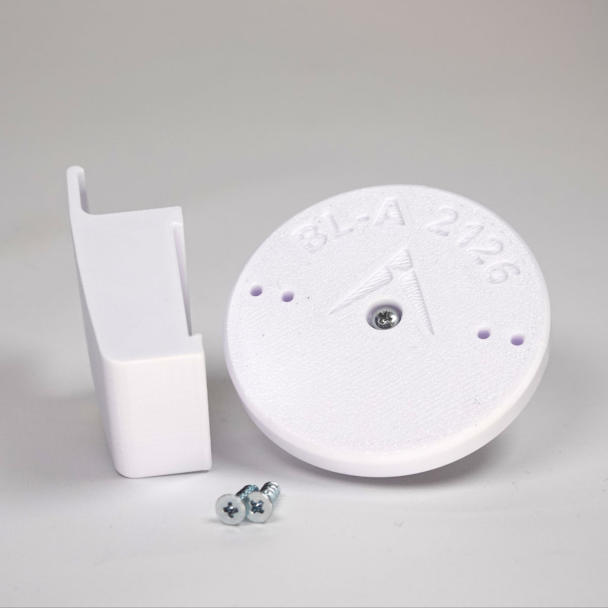 3D-printed traditional vinyl siding clip and circular mounting base for a Blink camera, include screws.