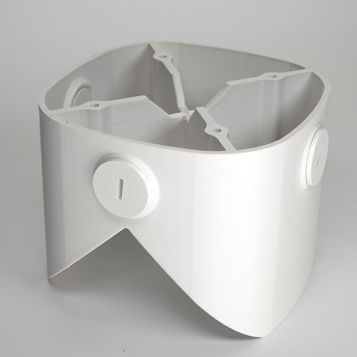 White 3D-printed outside corner mount for eufy floodlight cameras.
