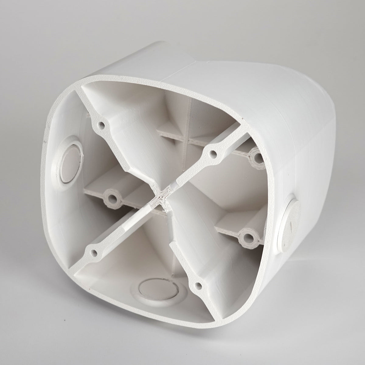 White 3D-printed outside corner mount for eufy floodlight cameras.