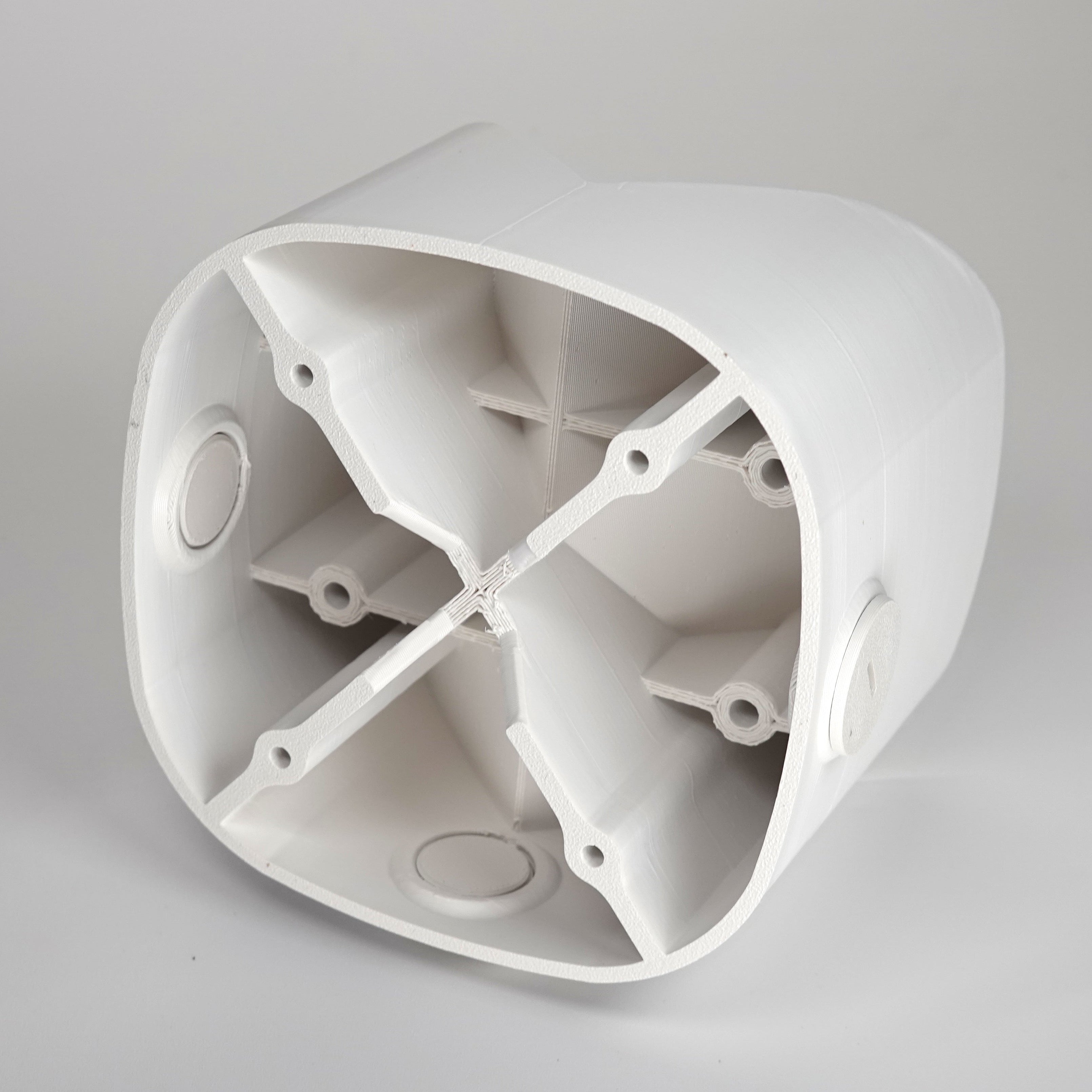 White 3D-printed outside corner mount for eufy floodlight cameras.