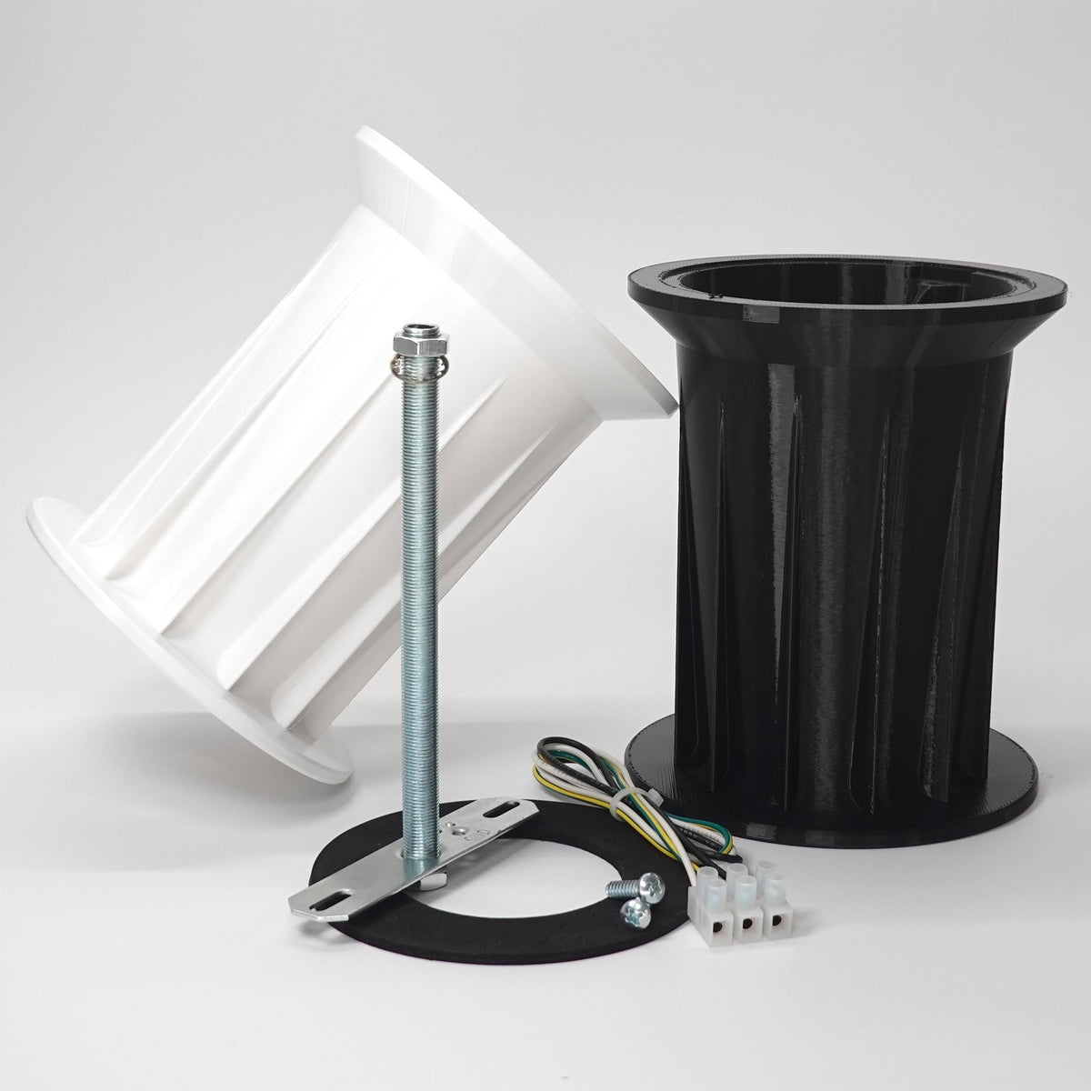 3D-printed soffit drop extensions for floodlight cameras.