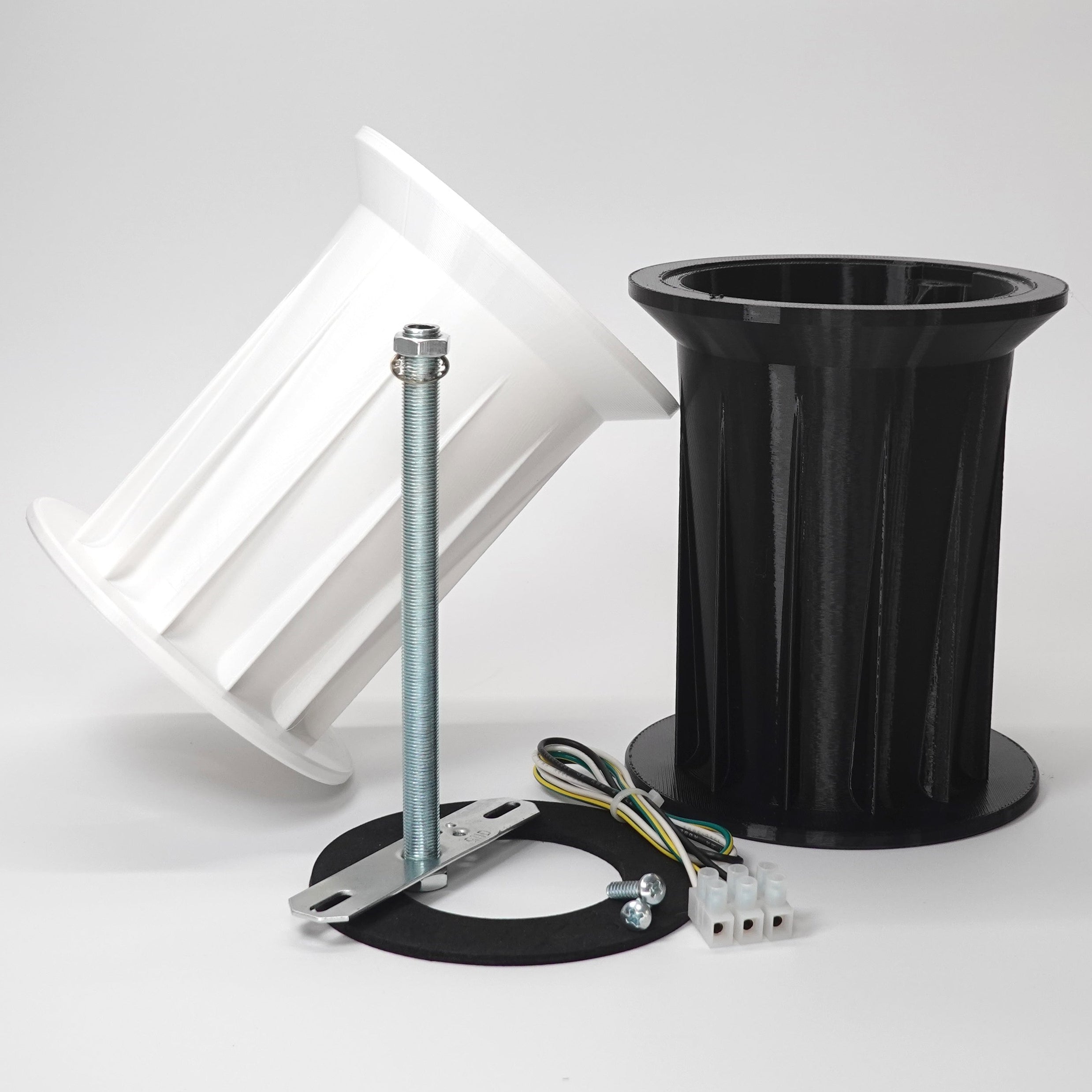 3D-printed soffit drop extensions for floodlight cameras.