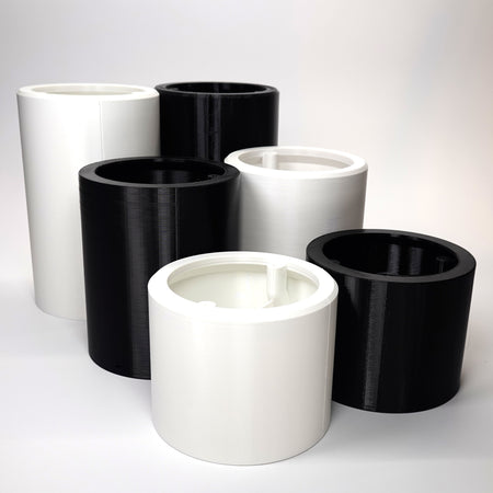 cylindrical wall standoff extensions for floodlight cameras in various lengths.