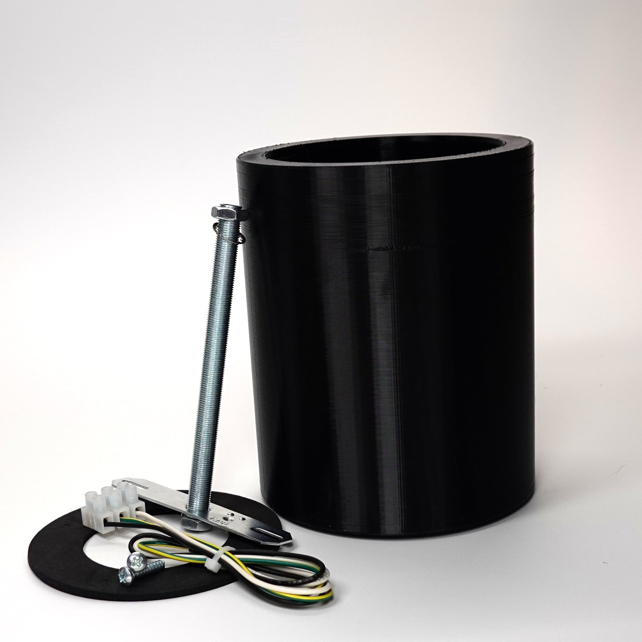 Black 150mm cylindrical wall standoff extension for floodlight cameras.