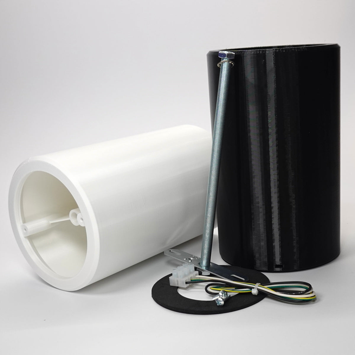 Cylindrical wall standoff extensions for floodlight cameras shown with mounting hardware, including a metal crossbar, screws, and wiring.