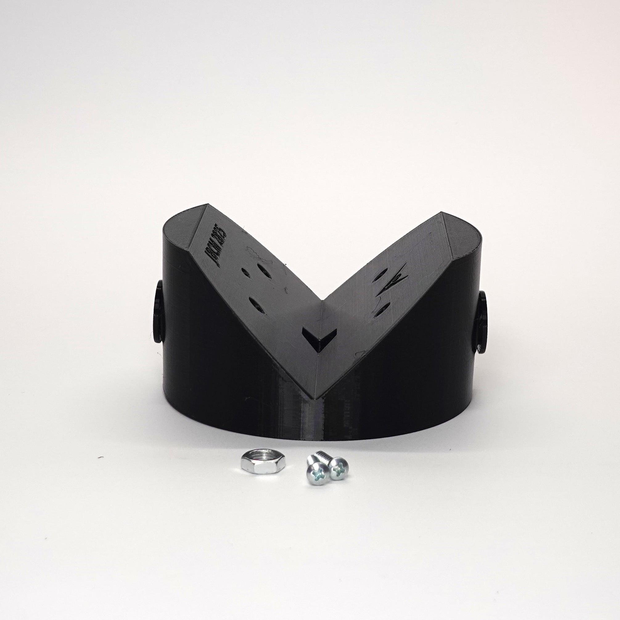 Black outside corner mount junction box for floodlights and cameras.