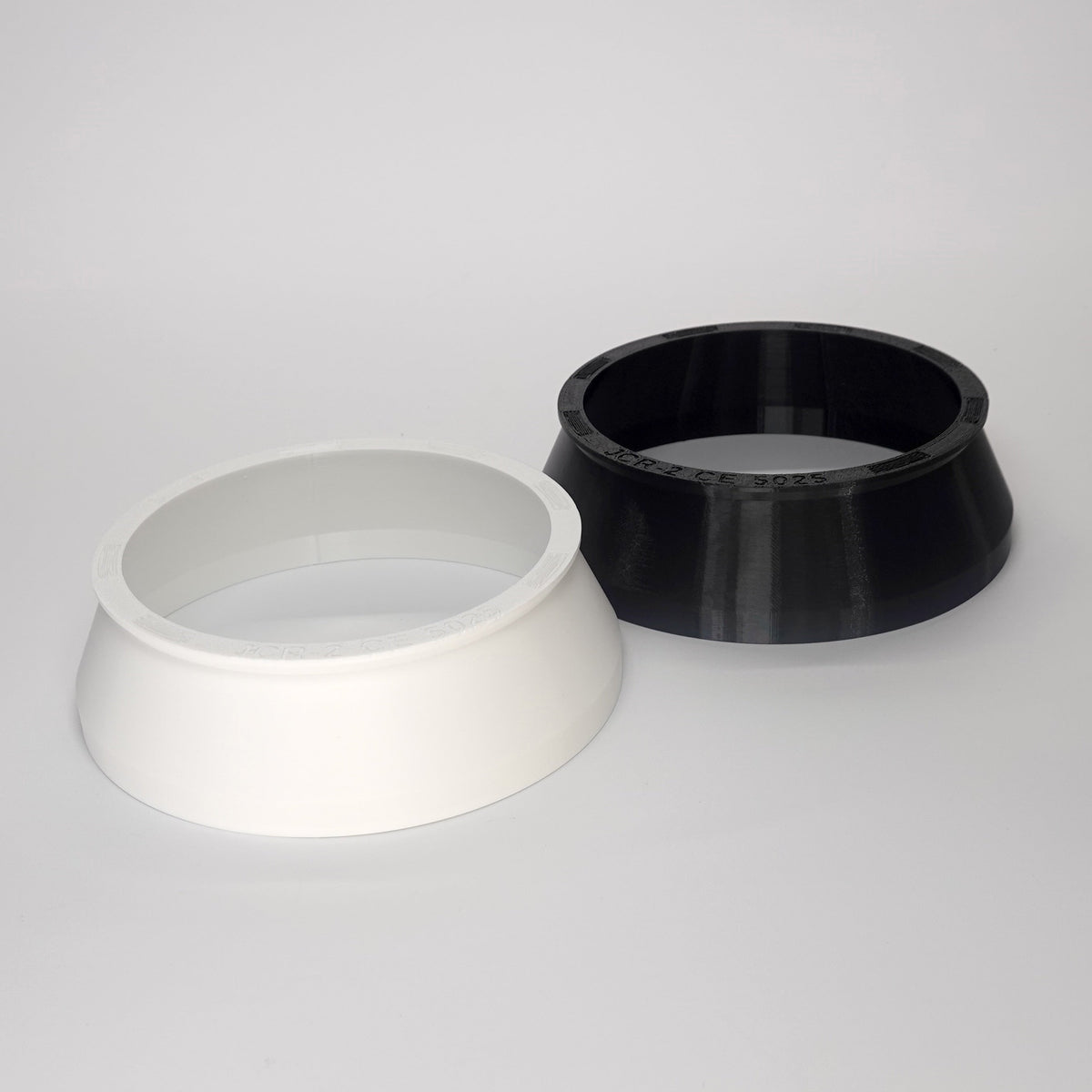 Round 2 (1.6") weatherproof junction box cover in white and black. 