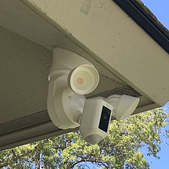 A Ring CAM Plus soffit mounted with Alexaclty White Slim 90 Floodlight Mount, Soffit Wedge and Round Cover