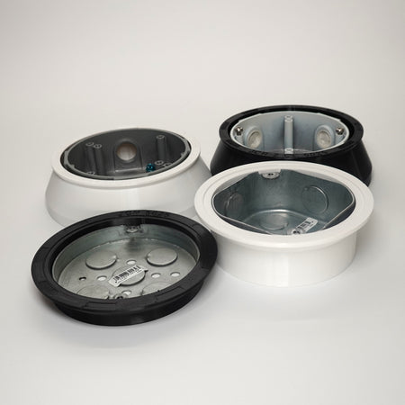 Round, octagonal and pancake junction box covers in black and white.
