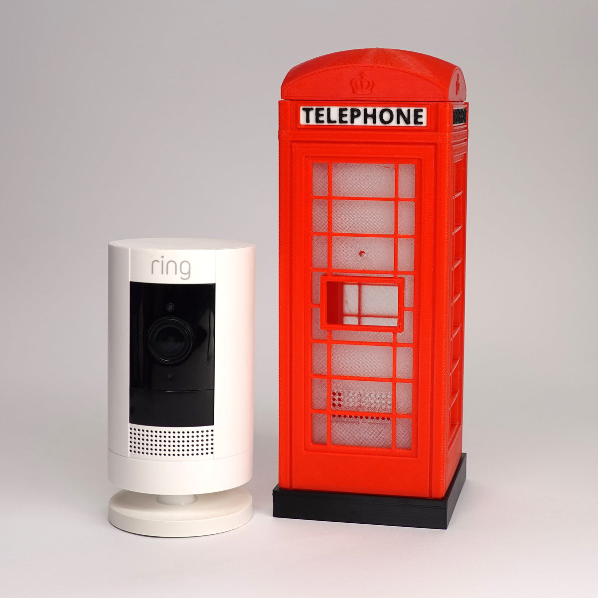 3D-printed miniature British K6 telephone box case for Ring Stick Up Cam Gen 3."