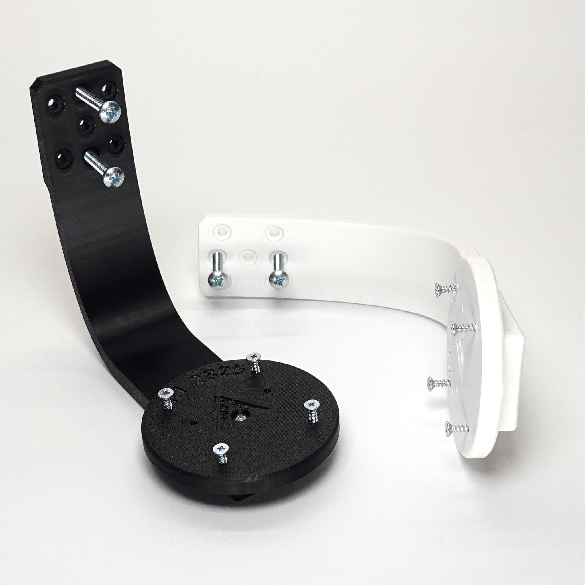 3D-printed Ring camera mounts in black and white, featuring curved arm brackets,  and included installation screws.