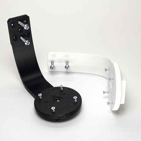 3D-printed Ring camera mounts in black and white, featuring curved arm brackets,  and included installation screws.