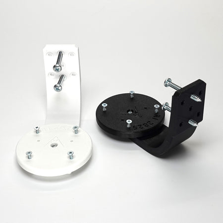 3D-printed Ring camera mounts in black and white, featuring curved arm brackets, and included installation screws.