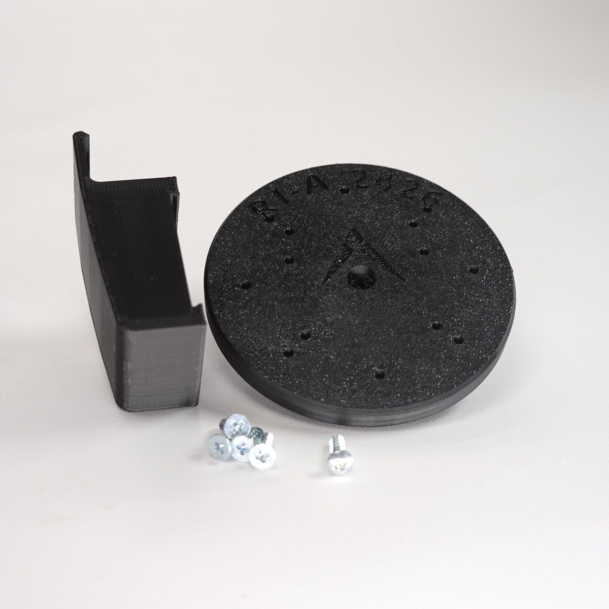 Black 3D-printed Traditional Clapboard siding clip and circular mounting plate for ring Cam Siding Clips, include five mounting screws.