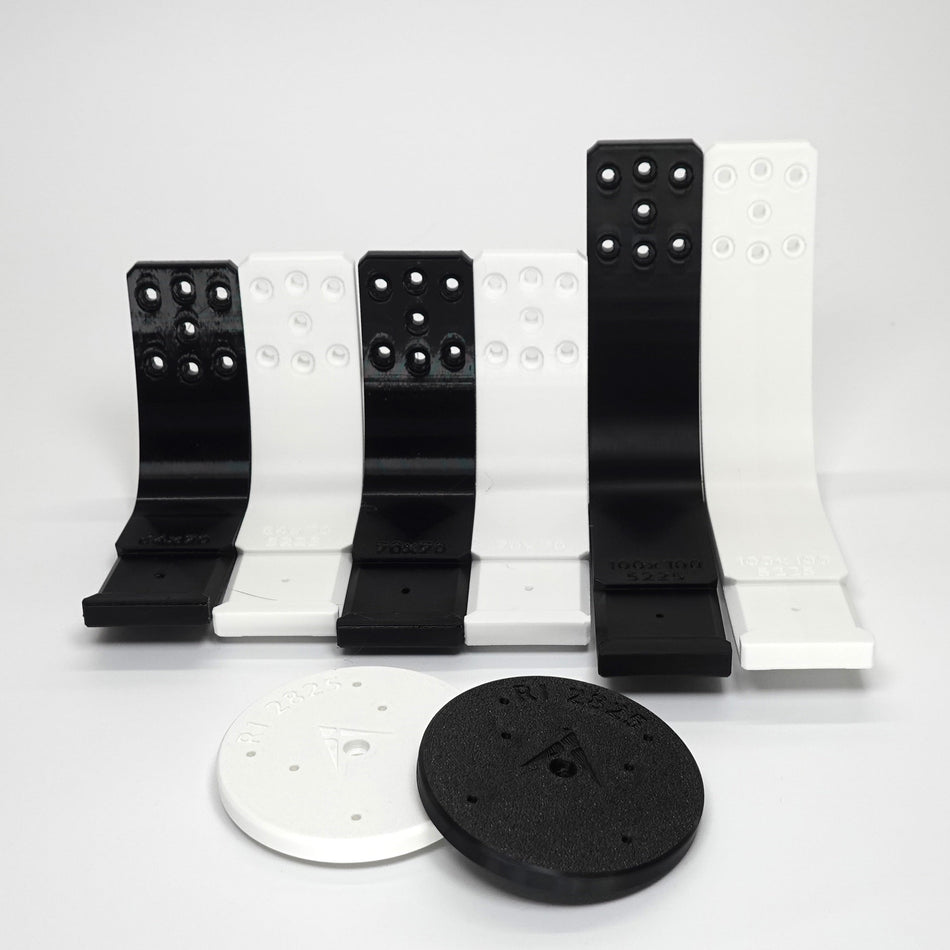3D-printed Ring camera mounts in black and white.