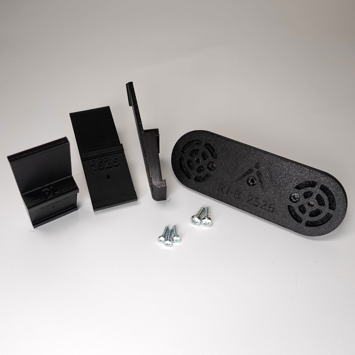 Black 3D-printed no-drill plank siding clip kit for a Ring Solar Panel.