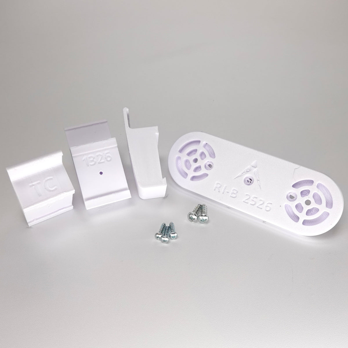 White 3D-printed no-drill Traditional siding clip kit for a Ring Solar Panel.