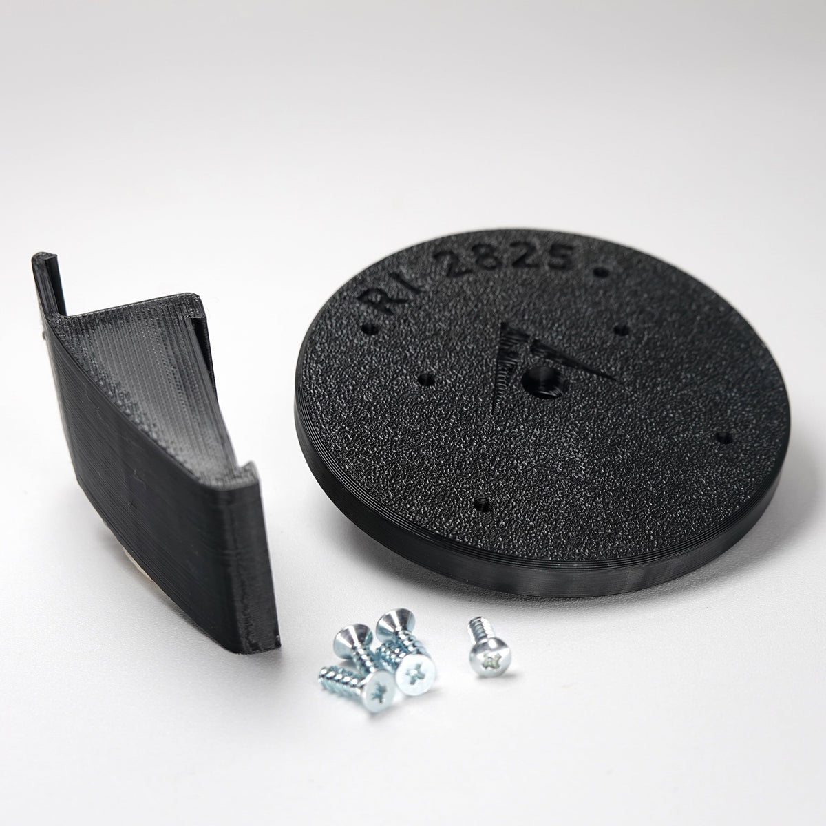Black 3D-printed Dutch Lap siding clip and circular mounting plate for ring Cam Siding Clips, include five mounting screws.
