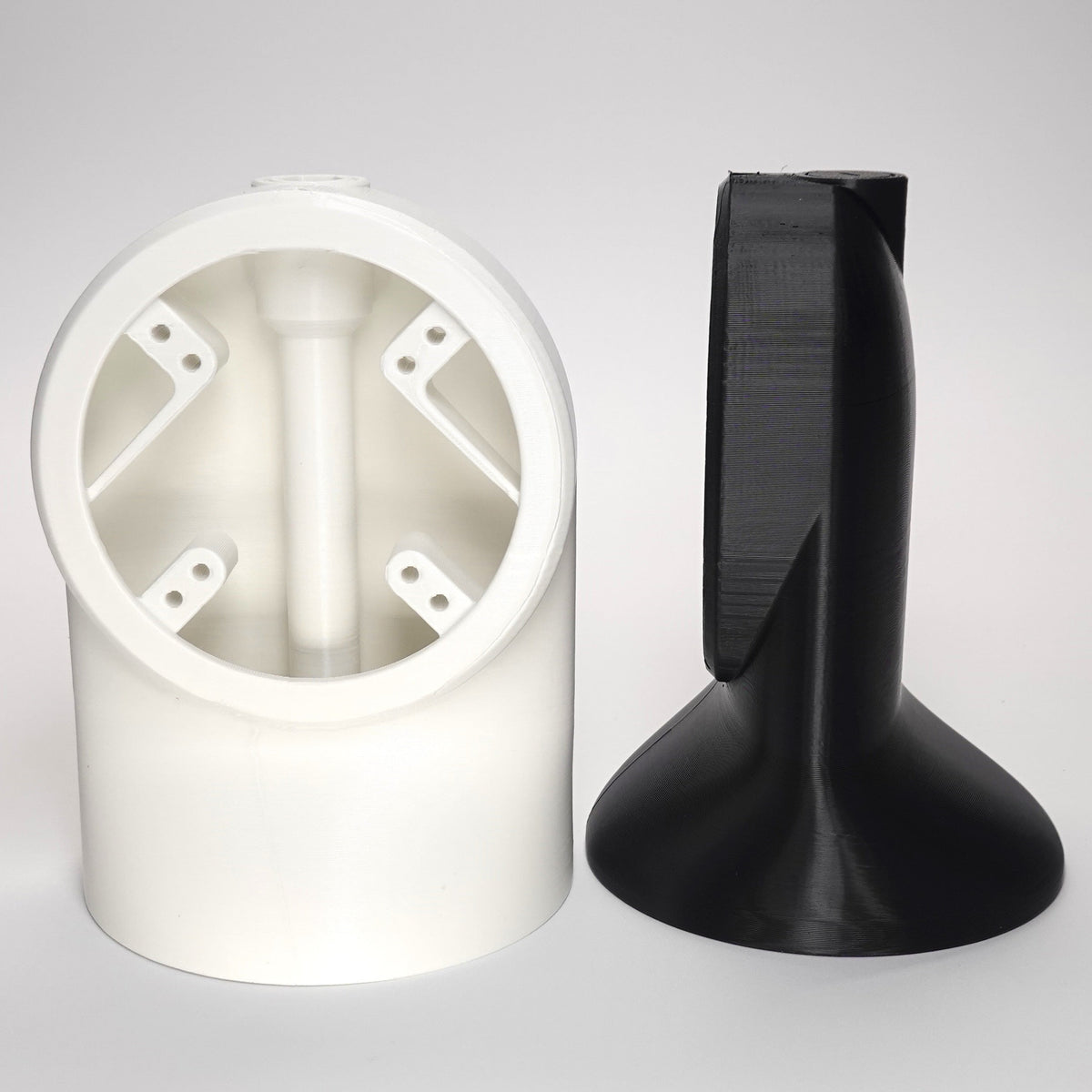 3D-printed Slim 90° Soffit Mounts for floodlight cameras.
