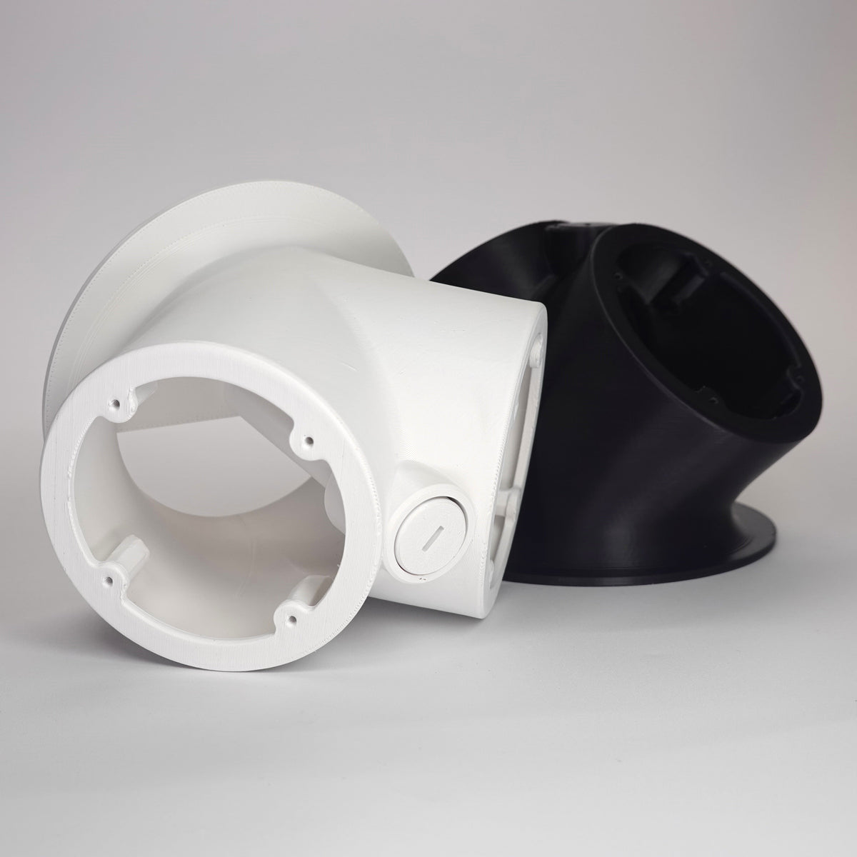 3D-printed 45-degree dual camera mounts for UniFi G Turret security cameras.
