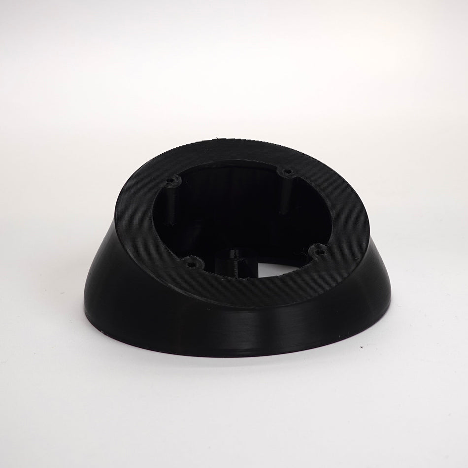 Black 3D-printed angled soffit wedge for UniFi G Turret camera.